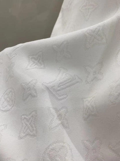 White all-over printed hidden logo shorts