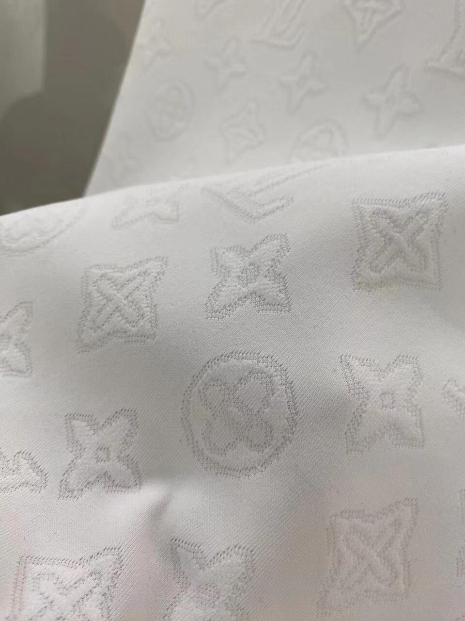 White all-over printed hidden logo shorts